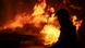 Сотрудник украинской службы спасения на фото обширного пожара после российского удара Сотрудник украинской службы спасения на фото обширного пожара после российского удара