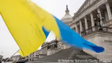 WASHINGTON, DC - FEBRUARY 11: Ukraine sympathizers fly a Ukrainian flag outside as the Senate works through the weekend on a $95.3 billion foreign aid bill with assistance for Ukraine and Israel at the U.S. Capitol on February 11, 2024 in Washington, DC. The bill includes $60 billion to support Ukraine in its fight against Russia, $14.1 billion in security assistance for Israel, $9.2 billion in humanitarian assistance and $4.8 billion to support regional partners in the Indo-Pacific region, among other provisions, according to the Senate Appropriations Committee. (Photo by Roberto Schmidt/Getty Images)