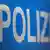 Напис німецькою мовою "поліція" (фотоілюстрація)
