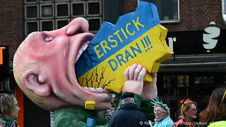 Carnival float depicts Russian president Vladimir Putin as he attempts to swallow Ukraine and the message: Choke on it!