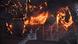 A firefighter sprays water to contain a blaze at the Liseberg park in Goteberg A firefighter sprays water to contain a blaze at the Liseberg park in Goteberg