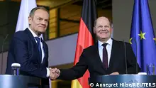 12.02.2024+++ German Chancellor Olaf Scholz shakes hands with Polish Prime Minister Donald Tusk at a press conference, at the Chancellery in Berlin, Germany February 12, 2024. REUTERS/Annegret Hilse 