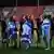 Israeli players drape themselves in flags as they shake hands before a match