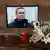 Flowers and a portrait of Russian opposition leader Alexei Navalny near the Russian embassy in Paris