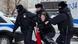 Police officers detaining a woman in Russia Police officers detaining a woman in Russia