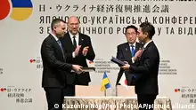 19.02.2024**Ukraine's Prime Minister Denys Shmyhal, second left, and Japanese Prime Minister Fumio Kishida, second right, with officials attend a cooperation exchange ceremony of a memorandum during the Japan-Ukraine Conference for Promotion of Economic Growth and Reconstruction at Keidanren Kaikan building in Tokyo, Monday, Feb. 19, 2024. (Kazuhiro Nogi/Pool Photo via AP)