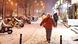 People walking down snowy street in Beijing People walking down snowy street in Beijing