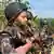 Armed members of Bangladesh border police look towards the Myanmar border