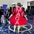 A woman shows off the back of her red dress, with MAGA written in large white letters
