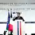 Muškarac za govornicom (Emmanuel Macron), pored njega zastave Francuske i Europske unije, iza njega natpis na engleskom: Konferencija o pomoći Ukrajini, 26. veljače 2024.