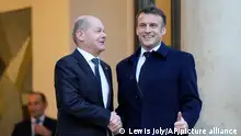 French President Emmanuel Macron, right, welcomes German Chancellor Olaf Scholz at the Elysee Palace in Paris, Monday, Feb. 26, 2024. More than 20 European heads of state and government and other Western officials are gathering in a show of unity for Ukraine, signaling to Russia that their support for Kyiv isn't wavering as the full-scale invasion grinds into a third year. (AP Photo/Lewis Joly)