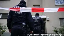 Policemen stand in front of a building believed to be the site where a German activist of the notorious far-left Red Army Faction (RAF) wanted for more than 30 years for attempted murder and other crimes has been arrested in Berlin, on February 27, 2024. Daniela Klette, 65, was part of a notorious fugitive trio from the RAF, which carried out bombings, kidnappings and killings in Germany in the 1970s and 1980s. (Photo by JOHN MACDOUGALL / AFP) (Photo by JOHN MACDOUGALL/AFP via Getty Images)
