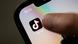 A teenager clicks on the TikTok icon on their smartphone A teenager clicks on the TikTok icon on their smartphone