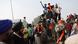 Farmers ride tractors and shout slogans while marching towards New Delhi Farmers ride tractors and shout slogans while marching towards New Delhi