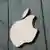 The Apple logo on a storefront