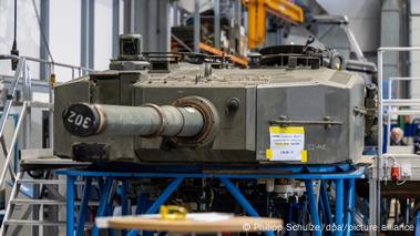 The turret of a tank on an assembly line