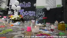 10/12/2023 Candles and messages are pictured in front of the carshop where Michel Dayana Gonzalez, a 14-year-old girl, was killed on the night of December 7th in Cali, Colombia, on December 10, 2023. According to the authorites, the main suspect is the security guard of the carshop, who is on the run as the authorites offered a ransom of 100 million pesos (approximately 25.000 US dollars) in exchange for information that would lead to his detention. (Photo by JOAQUIN SARMIENTO / AFP) (Photo by JOAQUIN SARMIENTO/AFP via Getty Images)