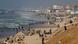 Palestinians gather on a beach in the hope of getting aid air-dropped over Gaza, amid the ongoing the conflict between Israel and Hamas Palestinians gather on a beach in the hope of getting aid air-dropped over Gaza, amid the ongoing the conflict between Israel and Hamas