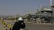 A photographer takes pictures of the Khurais oil field during a tour for journalists, 150 km east-northeast of Riyadh, Saudi Arabia, on June 28, 2021. A photographer takes pictures of the Khurais oil field during a tour for journalists, 150 km east-northeast of Riyadh, Saudi Arabia, on June 28, 2021.