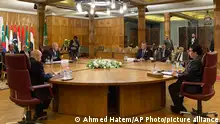 10/03/2024 *** Arab League Secretary-General Ahmed Aboul Gheit, seated centre left, meets with leaders of three parties of the conflict in Libya, at the Arab League headquarters, in Cairo, Egypt, Sunday, March 10, 2024. (AP Photo/Ahmed Hatem)