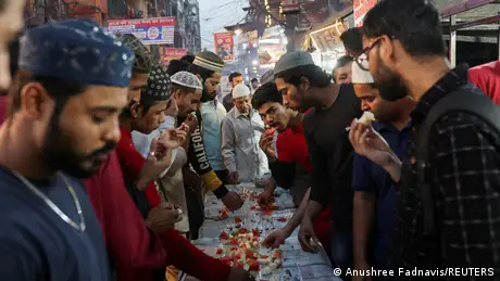 Long tables are set up on the streets of New Delhi, the mega-city in northern India, where Muslims eat together during Ramadan. 