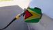 Una manguera carga combustible en un automóvil en Guyana. Una manguera carga combustible en un automóvil en Guyana.
