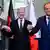 French President Emmanuel Macron, German Chancellor Olaf Scholz and Polish Prime Minister Donald Tusk join hands 