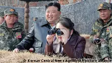 In this photo provided by the North Korean government, North Korean leader Kim Jong Un, center left, and his daughter inspect a training of the Korean People's Army airborne units in North Korea Friday, March 15, 2024. Independent journalists were not given access to cover the event depicted in this image distributed by the North Korean government. The content of this image is as provided and cannot be independently verified. Korean language watermark on image as provided by source reads: KCNA which is the abbreviation for Korean Central News Agency. (Korean Central News Agency/Korea News Service via AP)
