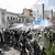 Policías antimotines lanzan gases contra unos manifestantes en Buenos Aires que portan pancartas en las que se lee "Polo obrero" o "Corriente clasista y combativa CCC".