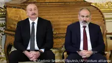 Armenian Prime Minister Nikol Pashinyan, right, and Azerbaijan's President Ilham Aliyev sit during a visit of CIS heads of state to the Catherine Palace on the sidelines of the Commonwealth of Independent States (CIS) heads of state meeting in St. Petersburg, Russia, Tuesday, Dec. 26, 2023. (Vladimir Smirnov, Sputnik, Kremlin Pool Photo via AP)