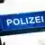 Znak na zgradi policije