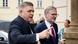 Two men walk side by side towards a building. The man in the foreground, Robert Fico (left), points with his right index finger while he speaks; the man beside him, Petr Fiala (right), looks in the direction in which Fico is pointing. Prague, Czech Republic, February 27, 2024 Two men walk side by side towards a building. The man in the foreground, Robert Fico (left), points with his right index finger while he speaks; the man beside him, Petr Fiala (right), looks in the direction in which Fico is pointing. Prague, Czech Republic, February 27, 2024