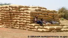 23/02/2024**Labourers rest on sacks of grains at a market in Gedaref, eastern Sudan, on February 22, 2024. Ten months into a war that has sent Sudan to the verge of collapse, the vast majority of its people are going hungry, the UN's World Food Programme said on February 21. Since last April, Sudan has been gripped by fighting between the regular army and the paramilitary Rapid Support Forces, which has killed thousands and created what the United Nations calls the world's largest displacement crisis. (Photo by Ebrahim Hamid / AFP) (Photo by EBRAHIM HAMID/AFP via Getty Images)