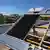 A picture of Sunmaxx solar panels on the roof of a building