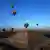 Globos aerostáticos sobrevuelan las pirámides de Teotihuacan, uno de los principales sitios turísticos de México, durante la celebración del equinoccio de primavera. (Imagen de archivo: 21.03.2024)