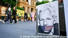 22/03/2024 *** A banner depicting Julian Assange seen outside the Town Hall. Protesters gathered outside the Town Hall to urge the Australian government to take action and bring Julian Assange, the Australian journalist who founded WikiLeaks, back to his home country from UK. (Photo by George Chan / SOPA Images/Sipa USA)