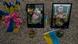 Photographs of men killed in Russia's war on Ukraine, surrounded by Urkrainian flags and flowers