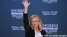 Italian Prime Minister Giorgia Meloni waves to supporters as she arrives at the Atreju political meeting organised by the young militants of Italian right wing party Brothers of Italy (Fratelli d'Italia) on December 16, 2023 at Sant'Angelo Castle in Rome. (Photo by Andreas SOLARO / AFP) (Photo by ANDREAS SOLARO/AFP via Getty Images)