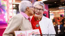 BANGKOK, THAILAND - FEBRUARY 14: Kan Keaddmeemun, 72, and Pakod-Chakon Wong Supha, 67, take part in a symbolic wedding for LGBTQ+ couples on Valentine's Day at Siam Center on February 14, 2024 in Bangkok, Thailand. On Valentine's Day, Thailand is hosting a Love without Borders mass wedding ceremony, incorporating the registration of symbolic same-sex marriages. As Thailand moves closer to legalizing same-sex marriage, a draft bill has been proposed in Parliament. If the bill is approved, Thailand will become the first country in Southeast Asia to legalize marriage for all. (Photo by Lauren DeCicca/Getty Images)