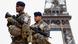 Armed French soldiers on patrol near the Eiffel Tower in Paris Armed French soldiers on patrol near the Eiffel Tower in Paris