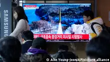 A news program airs a file image of a missile launch by North Korea at the Seoul Railway Station in Seoul, South Korea, on Tuesday, April 2, 2024. North Korea on Tuesday test-fired a suspected intermediate-range ballistic missile toward waters off its eastern coast, South Korea's military said, as it pushes to advance its weapons aimed at remote U.S. targets in the Pacific. (AP Photo/Ahn Young-joon)