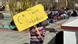 A protester in Leh holding a sign A protester in Leh holding a sign