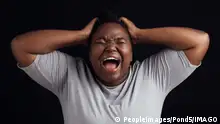 Anger, frustrated and black woman screaming, depression and mental health on a dark black studio background. Person, emotion and model shouting, anxiety and angry with grief, moody and lose control.