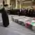 Ayatollah Ali Khamenei attends a ceremony in honor of the killed Revolutionary Guards, he seen standing next to several coffins, a large crowd is seen in the background