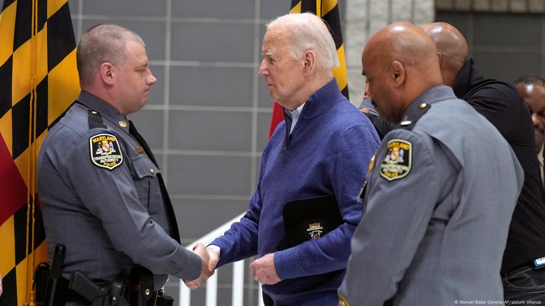 President Joe Biden (center) shakes hands with police officers in Baltimore 