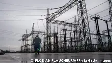 An employee of the Afam VI power plant walks past the electrical facility of the plant in Port Harcourt on September 29, 2015. Afam VI power plant is owned by the Shell Petroleum Development Company of Nigeria (SPDC) and maintained by Dietsmann company. Nigeria is Africa's largest producer, accounting for roughly two million barrels of crude daily. Shell has blamed repeated oil thefts and sabotage of key pipelines as the major cause of spills and pollution in the oil-producing region. AFP PHOTO / FLORIAN PLAUCHEUR (Photo by FLORIAN PLAUCHEUR / AFP) (Photo by FLORIAN PLAUCHEUR/AFP via Getty Images)