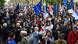 People in Tbilisi protesting against "foreign agent" law with EU and Georgian flags People in Tbilisi protesting against "foreign agent" law with EU and Georgian flags