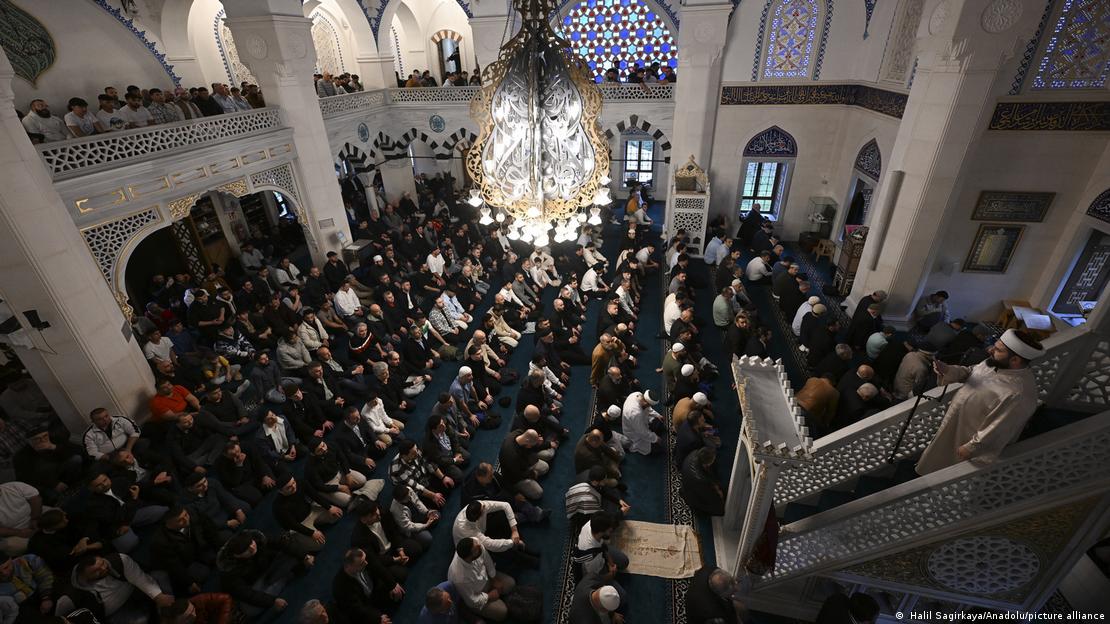 Muslims take part in the Eid al-Fitr prayer at the Martyrs Mosque in Berlin on April 10