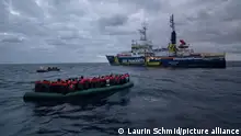 The Italian Coostguard rescues 42 people from a rubberboat in distress in the mediterranean sea north-west of Pantelleria, Italy, on 2nd February 2024. The NGO SOS Humanity supportas the rescue by doing the first approach and supporting life jackets.