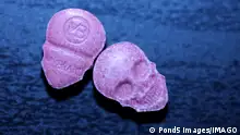Pink skull ecstasy pill close up background high quality prints purple army dope narcotics substance high dose psychedelic way of life
